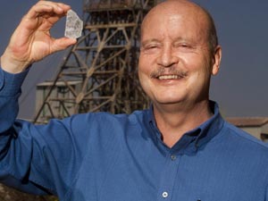 Johan Dippenaar, CEO Petra Diamonds, holds the 507 carat rough diamond found at Cullinan mine.