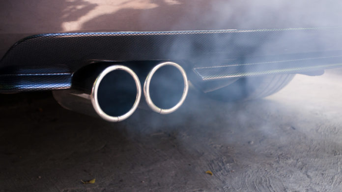 Car exhaust pipe expelling smoke