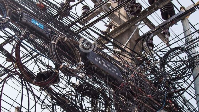 messy-entangled-electricity-telecommunication-wires-cables-messy-entangled-electricity-telecommunication-wires-cables-poles-126231251