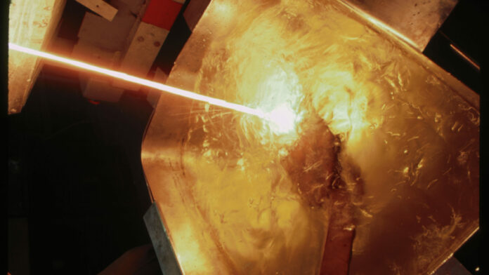 Molten Platinum Pouring into Vat of Liquid